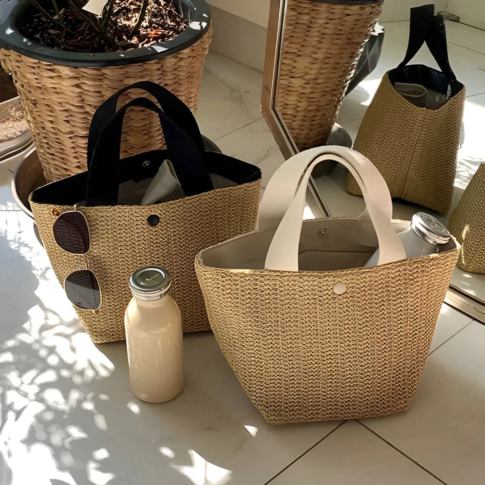 Casual rattan straw shoulder bag in black, bucket shape with shoulder strap