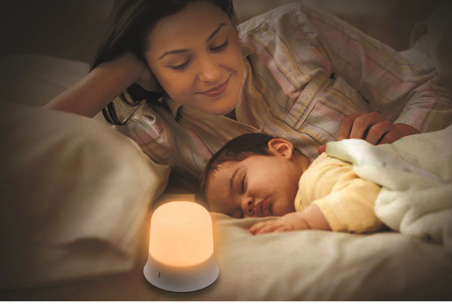 White touch control bedside night light with rechargeable battery and motion sensor on a table.