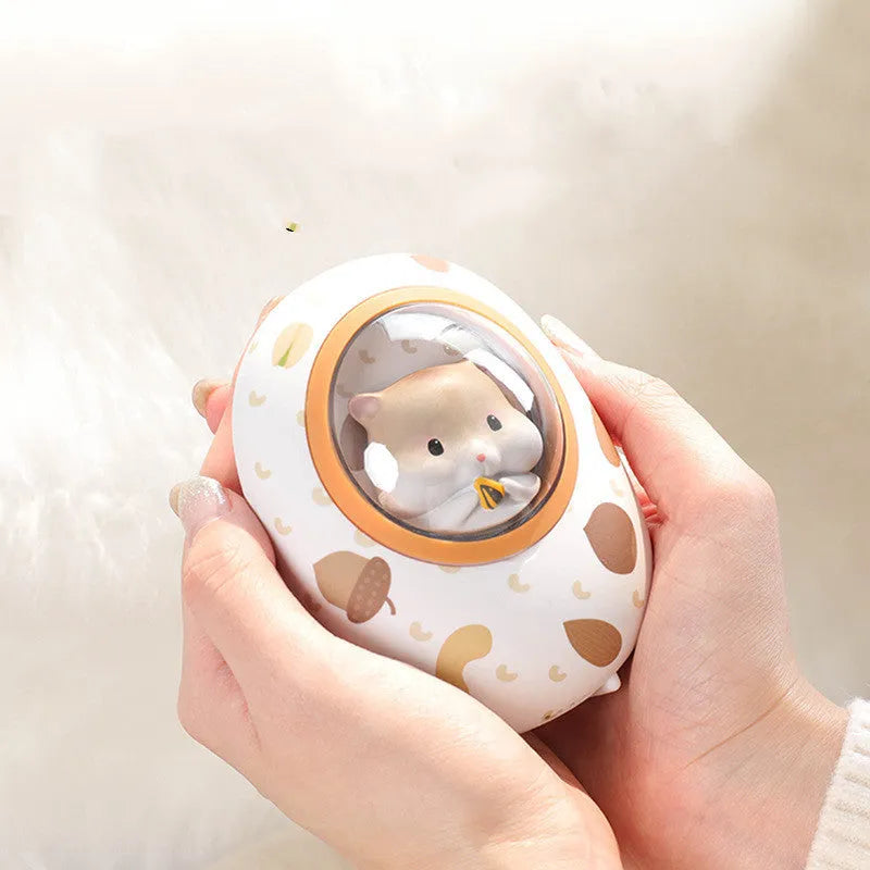 White Hamster hand warmer and power bank unit showing compact dual-function design.