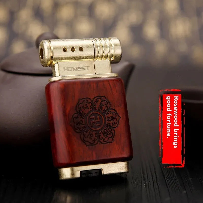 Ebony gas lighter with rosewood sun face design and black wood finish