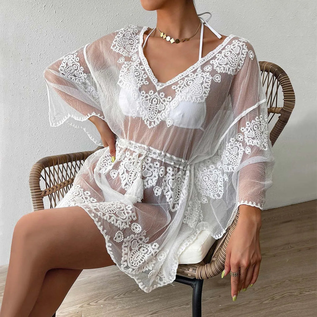 White polyester beach blouse for women, free size, with a cotton blend lining.