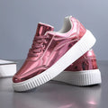 Rose gold sequinned platform sneakers with a thick MD sole and round toe on a white background.