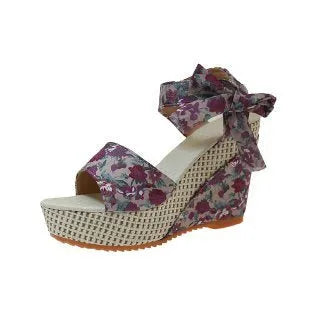 Women's floral wedge sandals with fish mouth peep toe and ankle strap buckle in pink, black, and blue patterns.