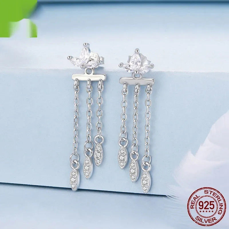 Pair of silver ear studs with small flower and tassel front and rear structure, BSE1240 colour, on light background