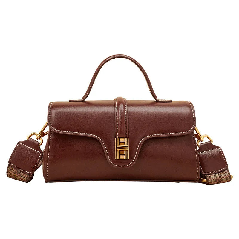 Niche retro Cambridge messenger bag in brown cow leather with lock detail and clamshell opening
