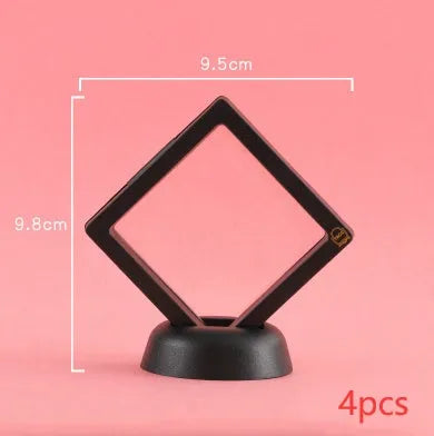 3D floating display case holding a coin suspended between transparent membrane sheets, black frame