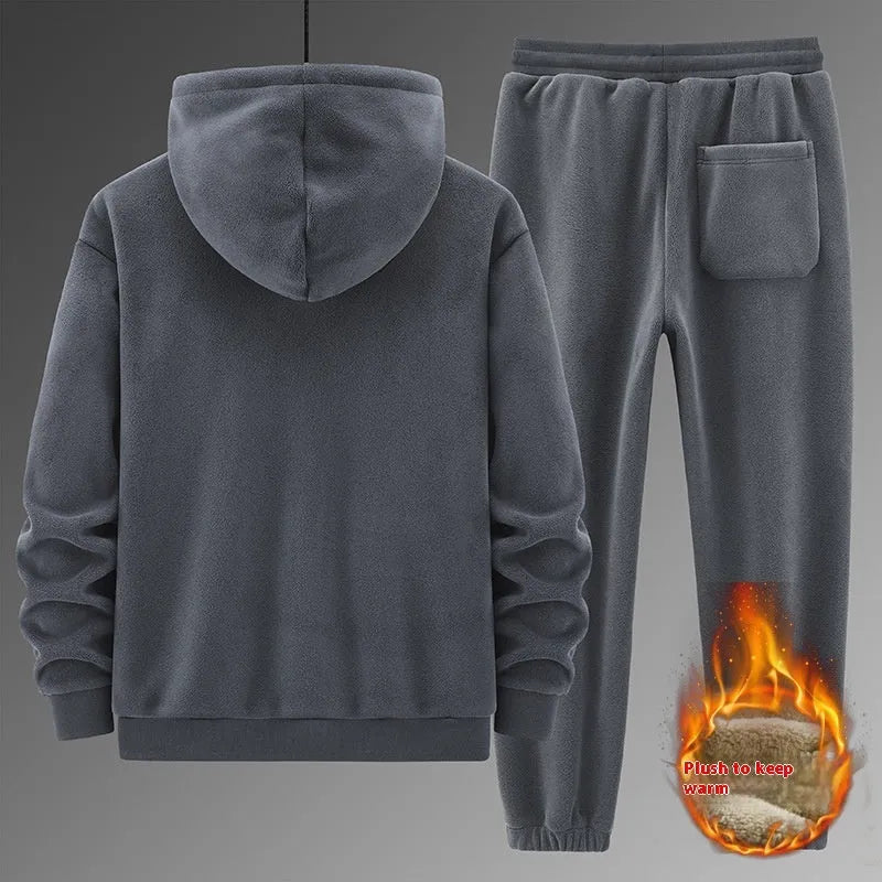 Grey men's hooded sports suit with long sleeves and full-length trousers on a neutral background.