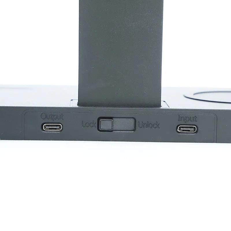 Black wireless charging station with brackets for mobile phone, smartwatch and headset