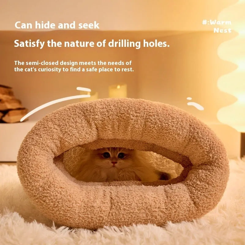 Brown semi-enclosed plush pet sleeping bag or cat nest bed on a wooden floor.