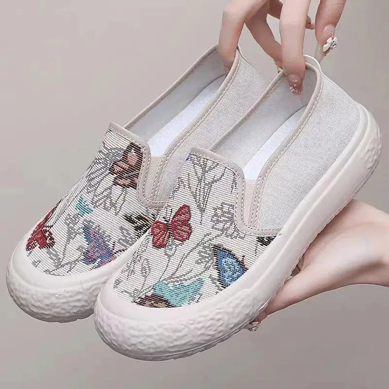 Women's canvas slip-on shoes with plastic injection-moulded sole and decorative sewing thread details