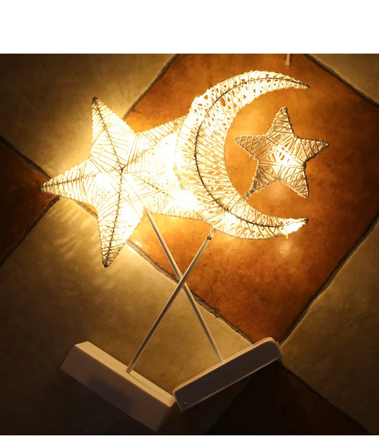 Rattan and copper wire LED table lamp in star, heart, or moon shape for bedroom decoration.