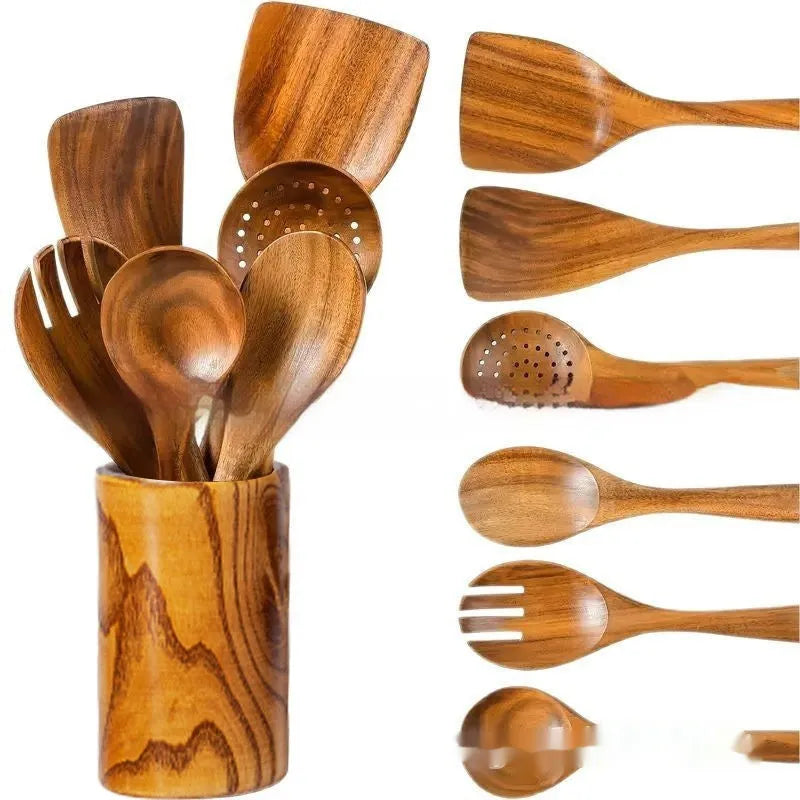 7-piece wooden kitchen utensil set with spoons and spatula on a table.