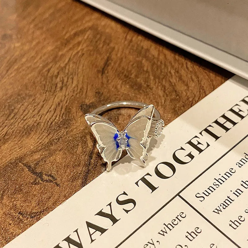 Simple copper women's ring with a Chinese butterfly design, showing an example from the 33 available numbered styles.