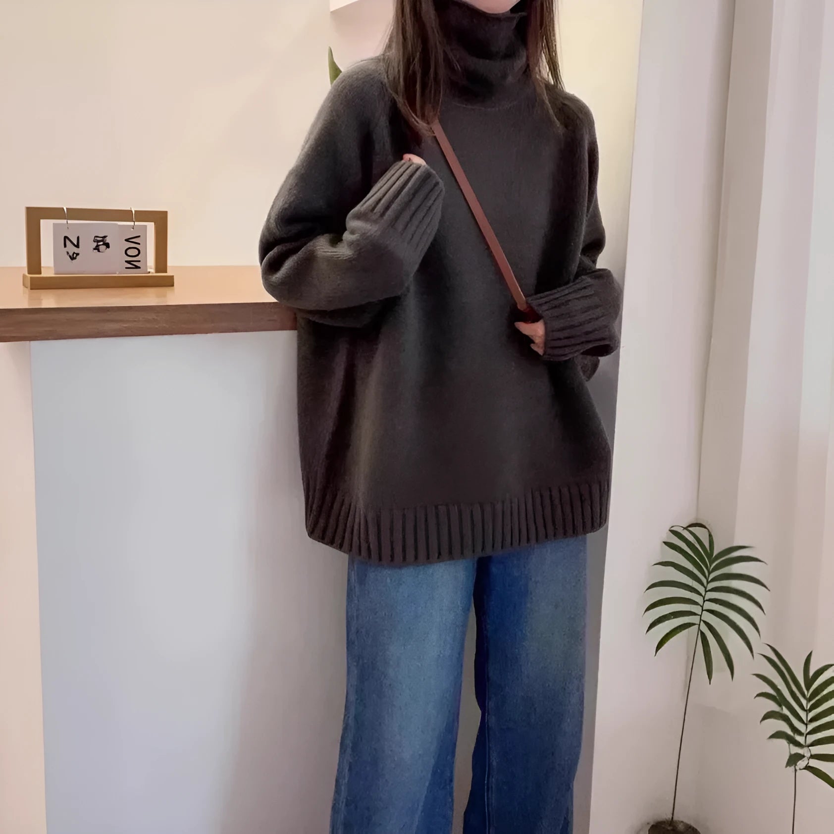 Women's loose turtleneck sweater with thick curling pile collar in red colour