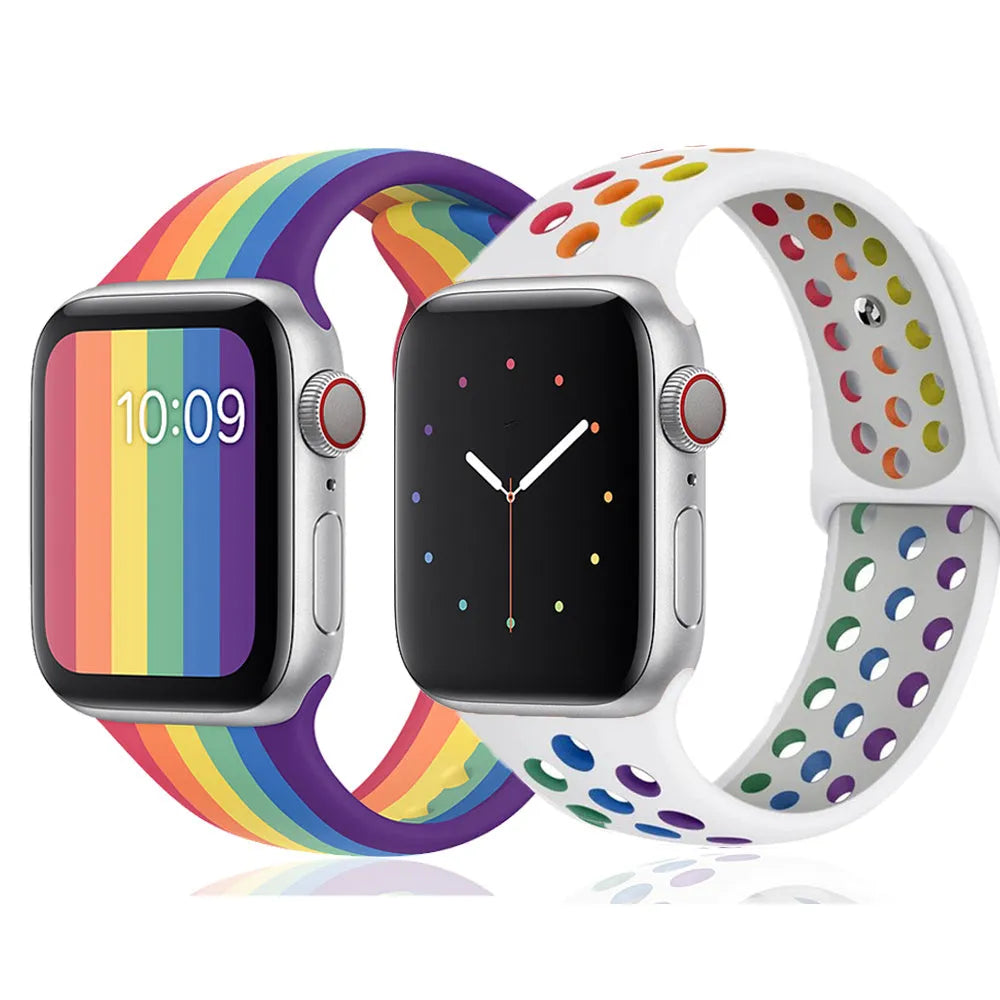 Silicone sports wristband with a single buckle closure shown in black, rainbow, and white colours.