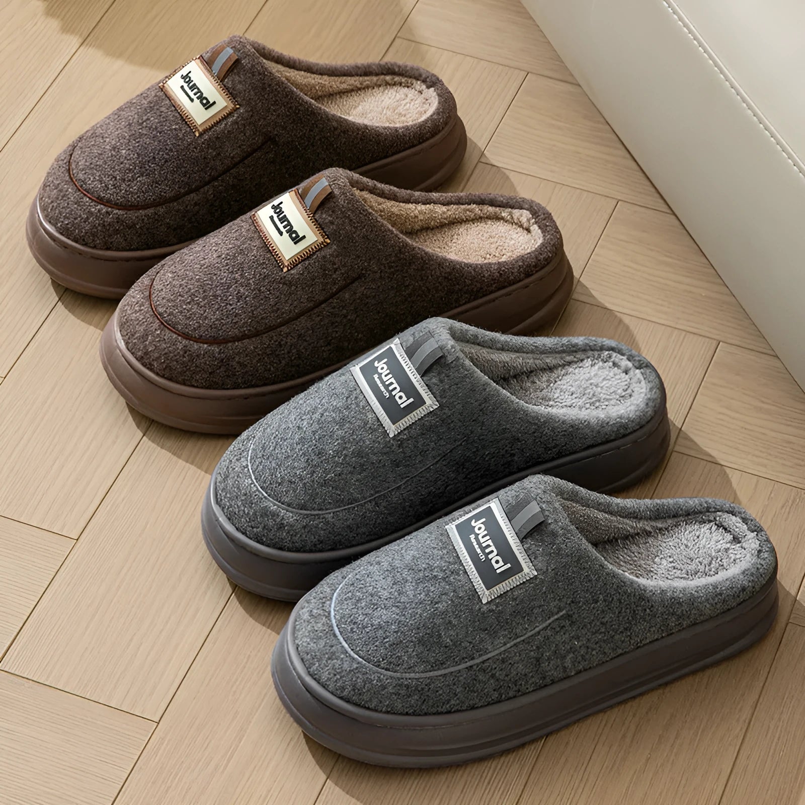 Men's brown and grey suede slippers with a thick sole on a plain background