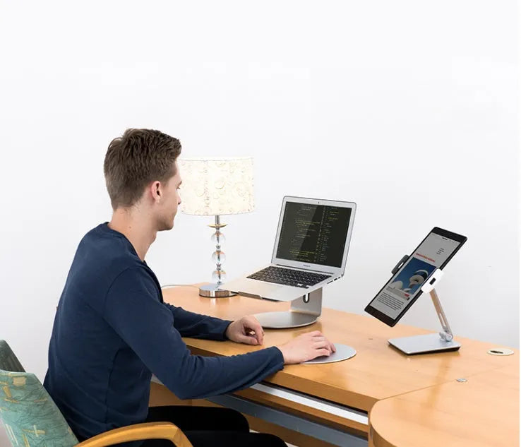 Folding aluminium phone and tablet stand in black showing 360° rotation and anti-slip silicone pads
