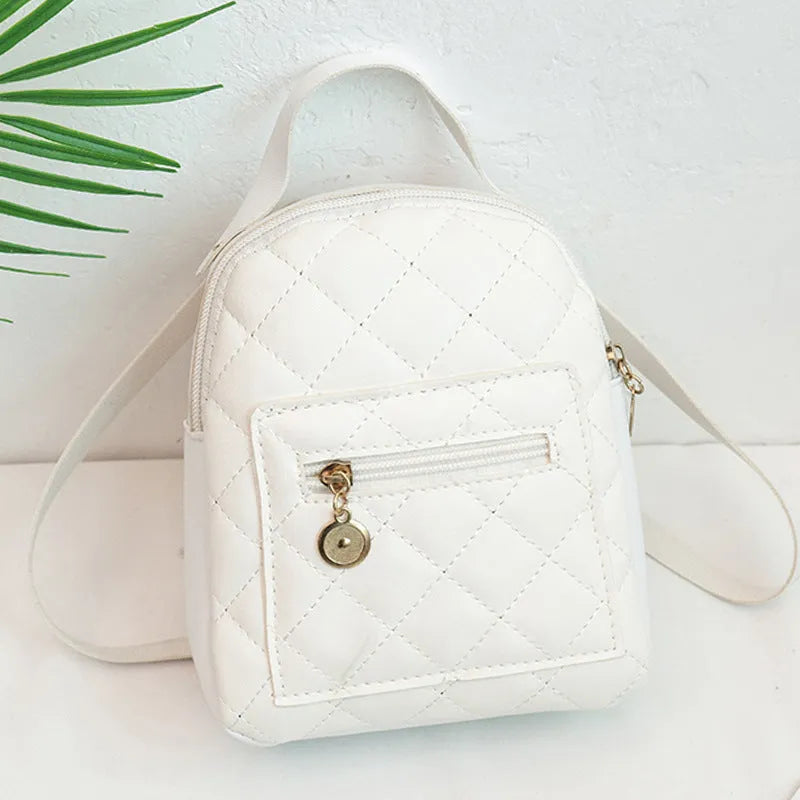 Girls' hard structured backpack with embroidery in white, black, or pink colours, showing front view and soft handle.