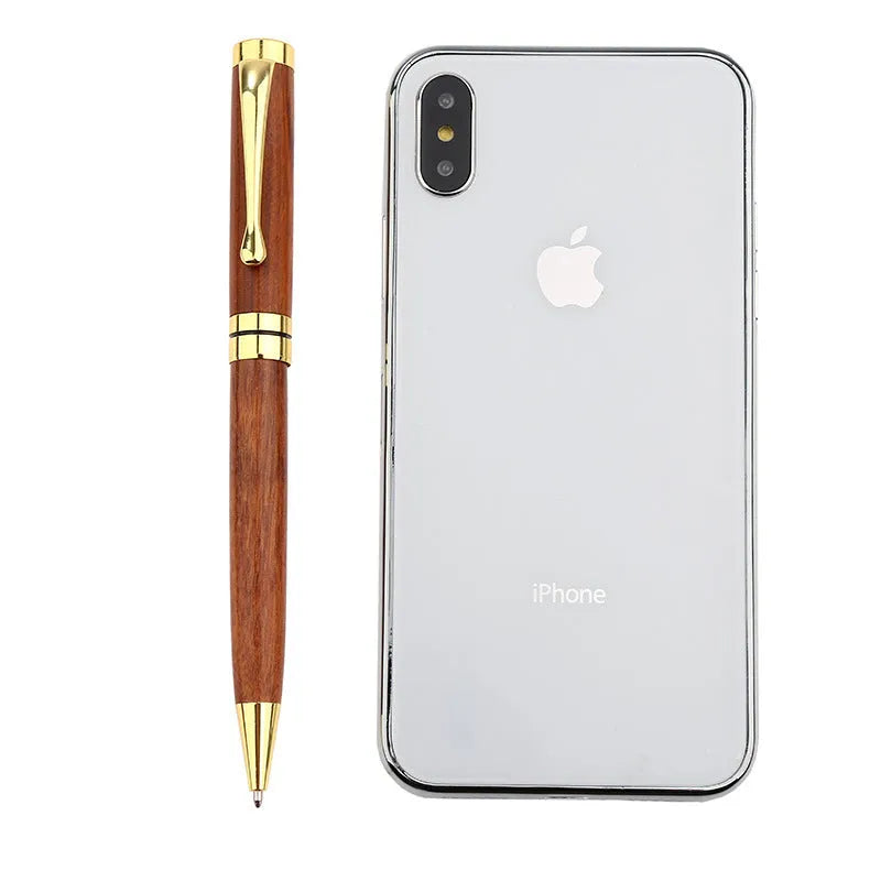 Wooden metal ballpoint pen with rosewood barrel on white background