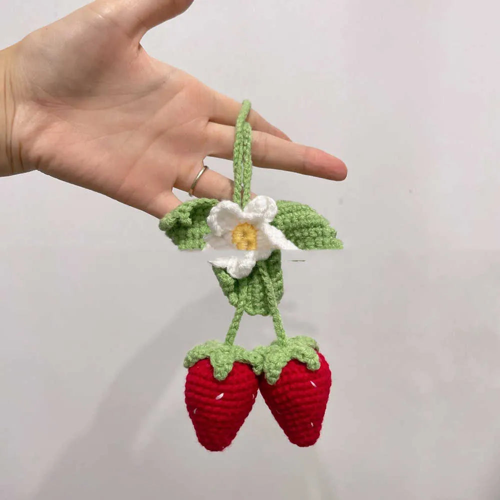Handmade woven strawberry-shaped car pendant made from cotton and hemp knitting wool.