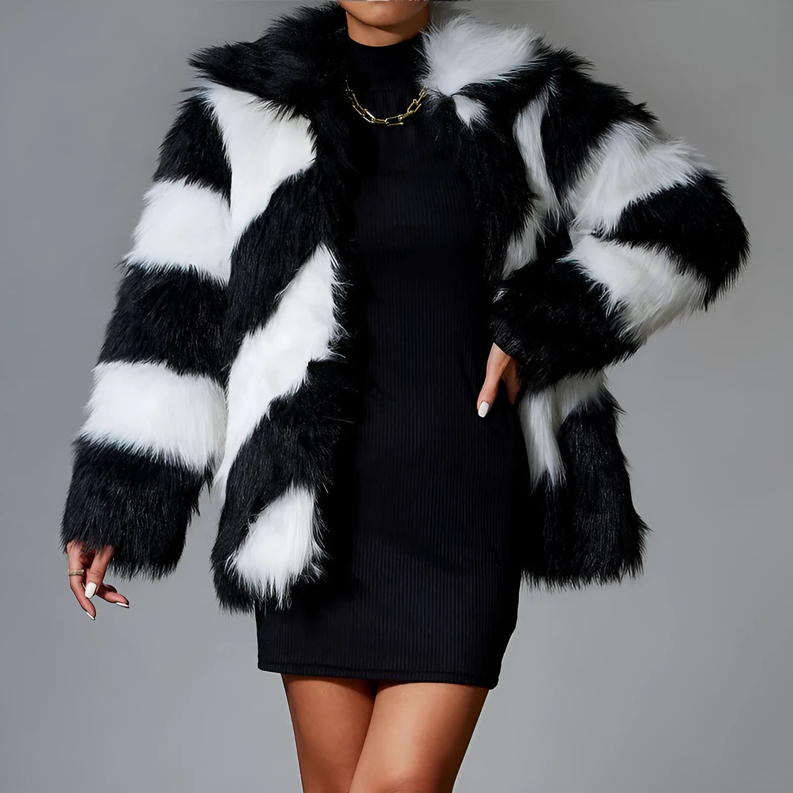 Black and white contrast lapel faux fur coat with a fur collar, shown on a model.