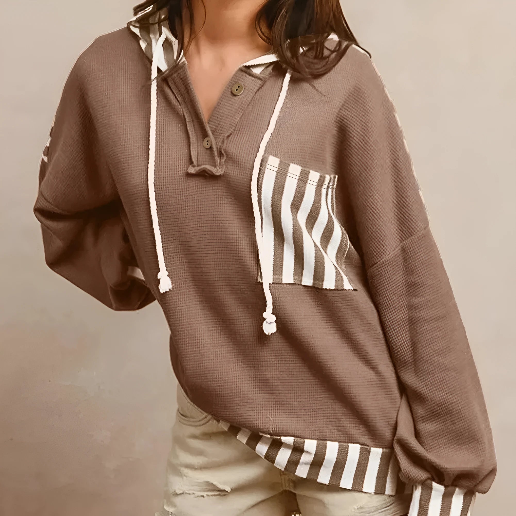 Straw yellow striped patchwork hoodie with waffle texture fabric and a drawstring hood.
