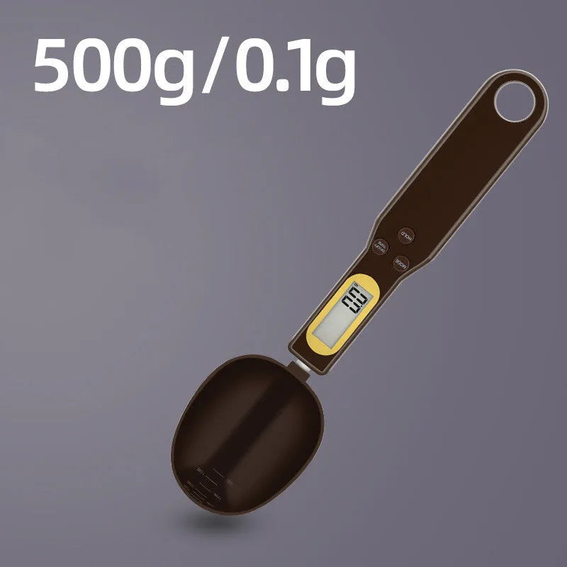 Black electronic measuring spoon scale on a kitchen counter showing digital display.