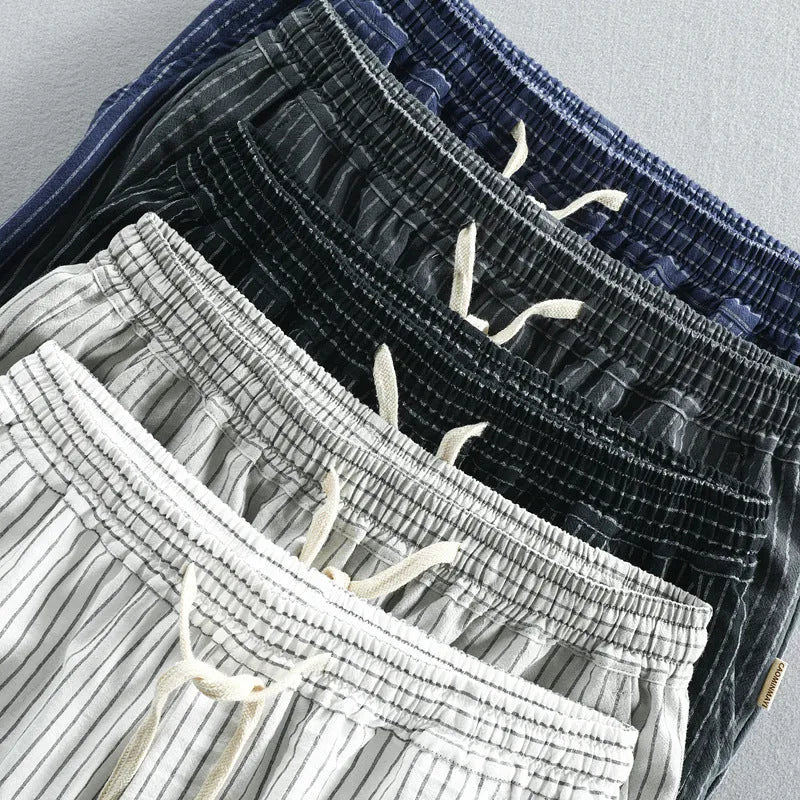 Men's striped casual shorts in cotton, shown in a loose straight-leg fit on a mid-waist.