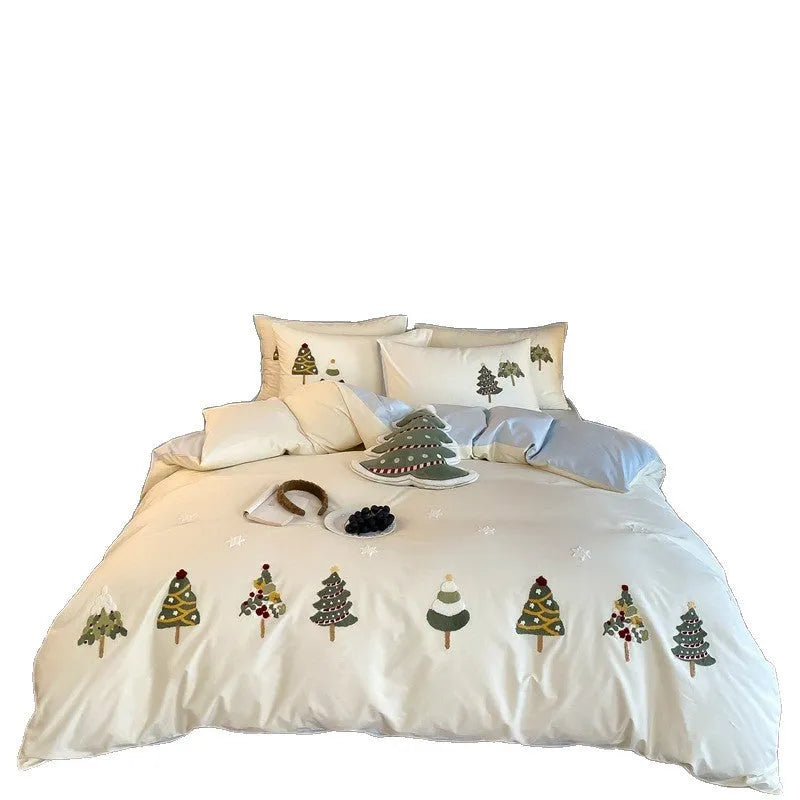Cream blue duvet cover with raised towel embroidery of Christmas trees and flowers, part of a four-piece pure cotton bedding set.