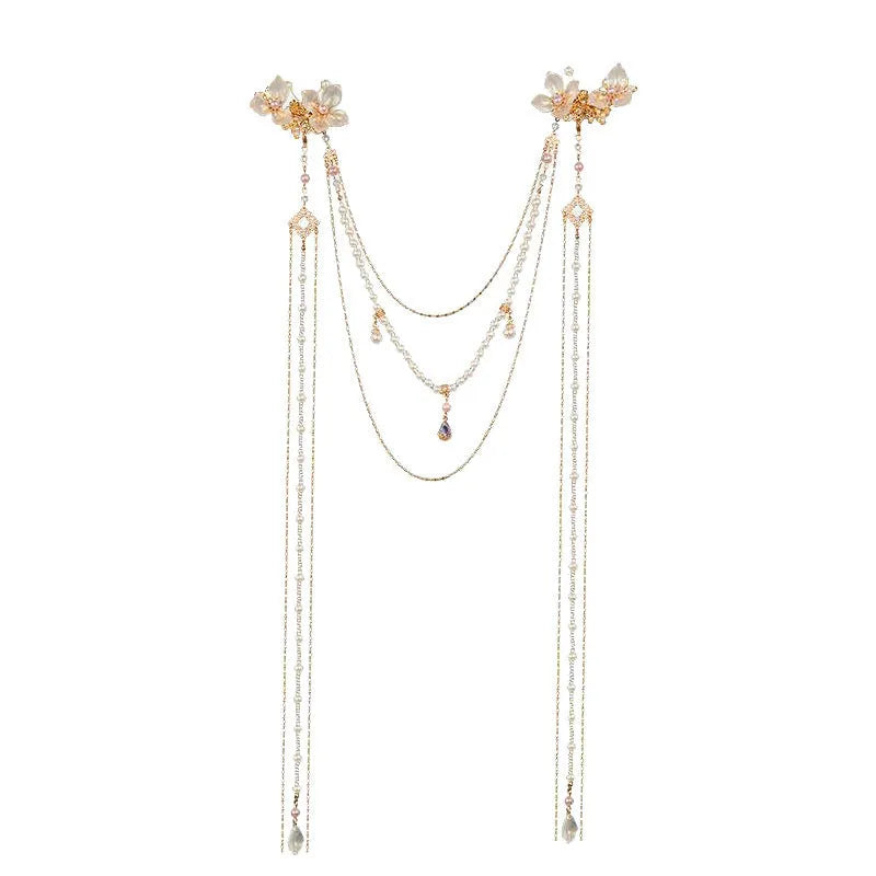 Women's gold pearl diamond flower long tassel hairpin on white background
