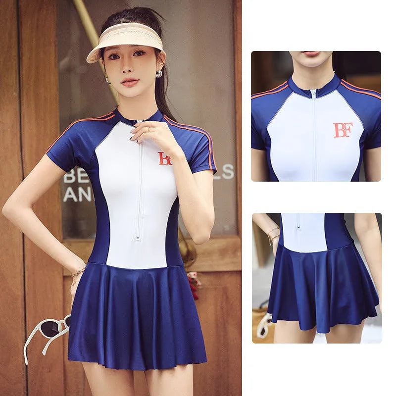 Conservative women's sports one-piece swimsuit in a colour-block pattern, shown in colour E92 or E93.