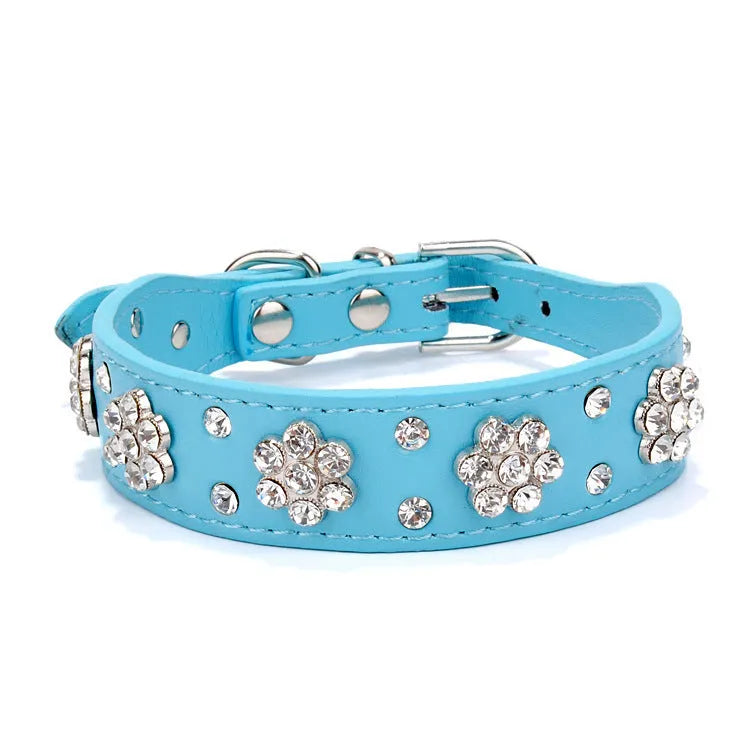 Black PU leather dog collar with studded rhinestone flower pattern and metal D-ring.