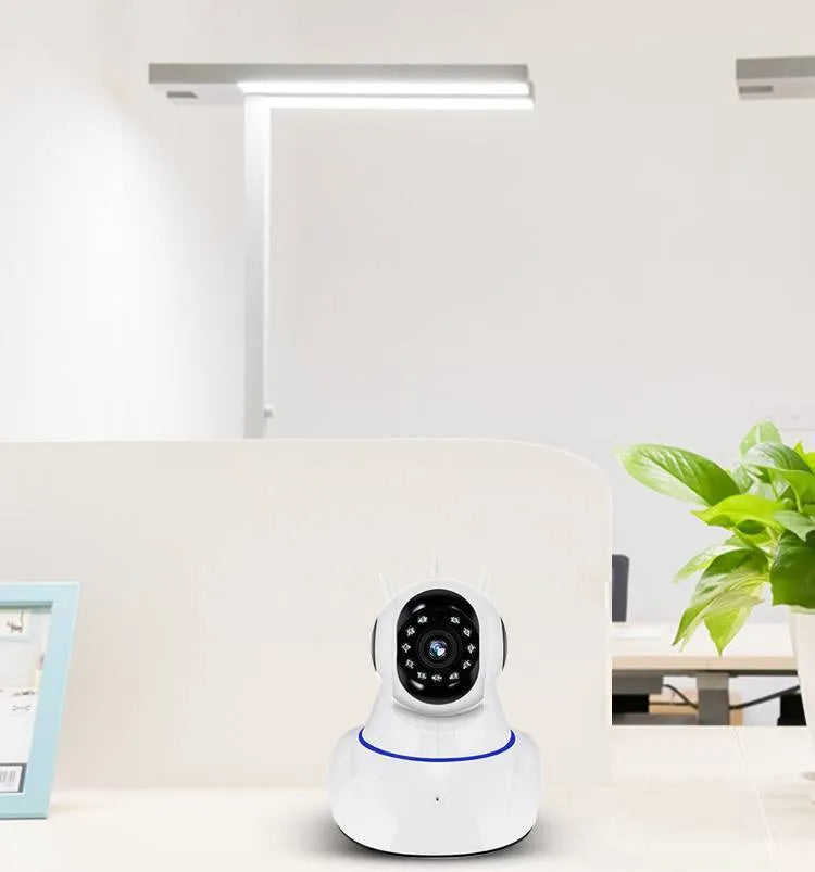 White wireless dome security camera with a 3.6mm lens, shown mounted on a ceiling.