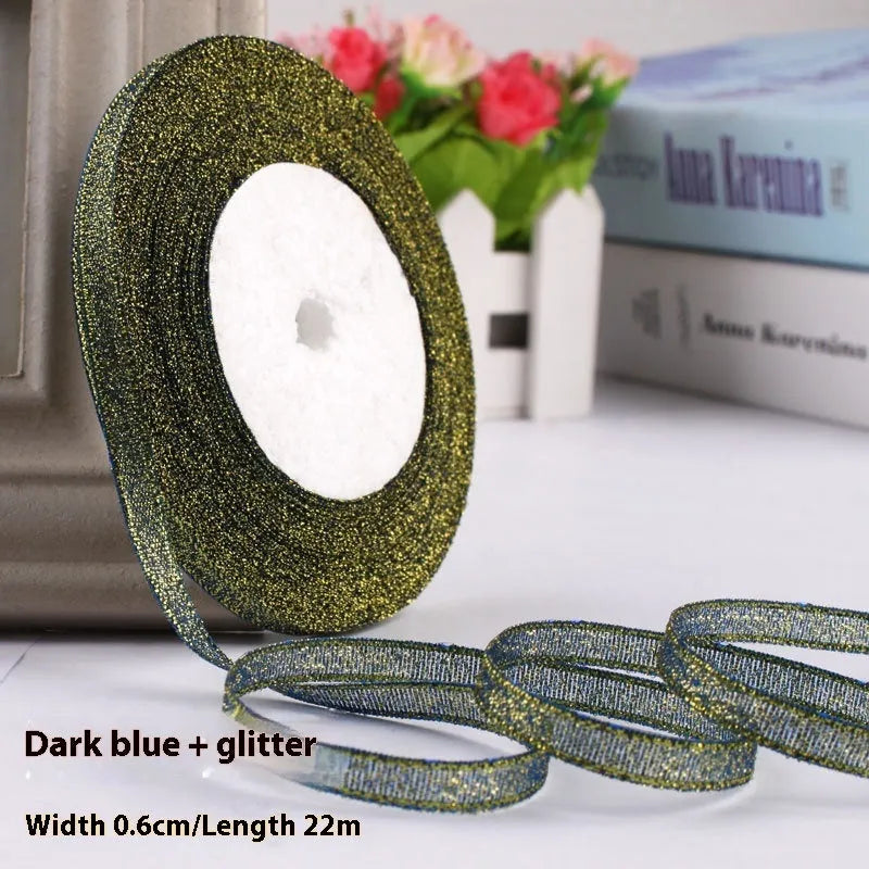 Roll of narrow 0.6cm wide polyester gift ribbon in a choice of colours including metallic gold and silver.