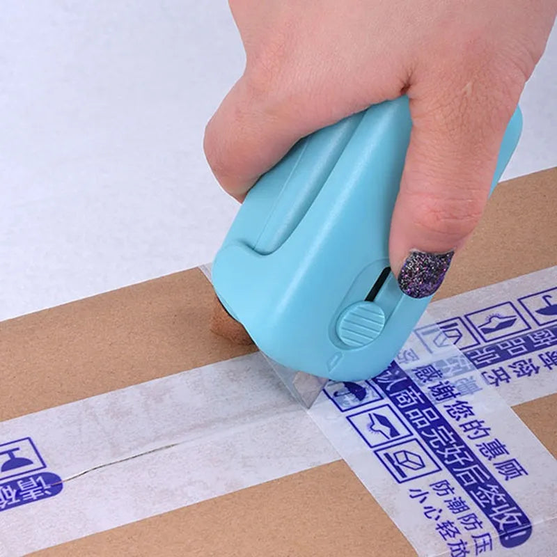 Mini hand pressure heat sealing machine in blue on white background, 10cm long ABS and metal body