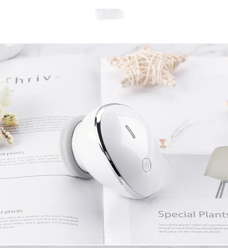White multifunction USB charging facial cleansing massager with hot egg design, silicone brush head, and 5 vibration modes on a white background