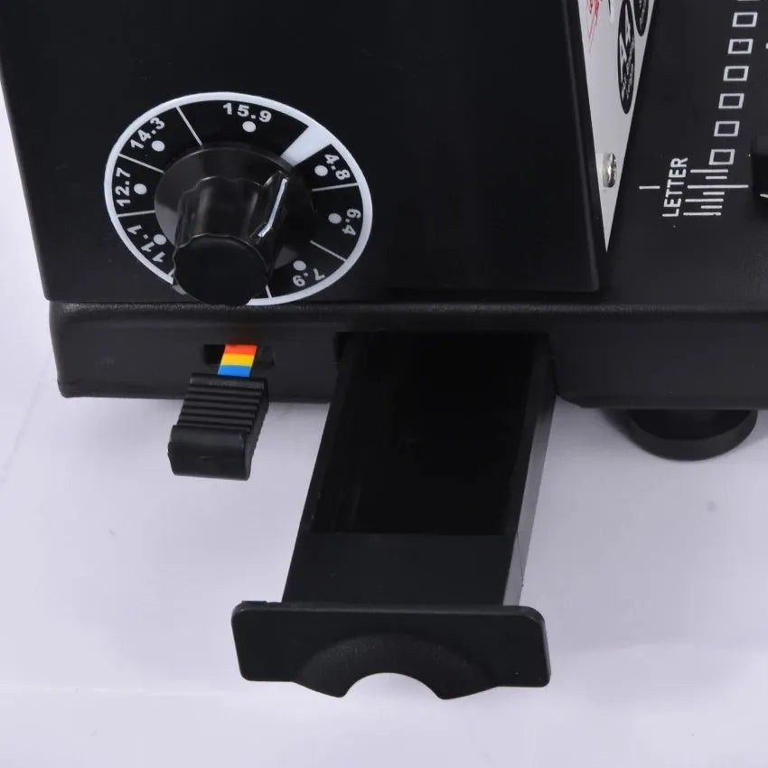 Leisheng 34-hole black manual iron ring binding machine on desk with paper