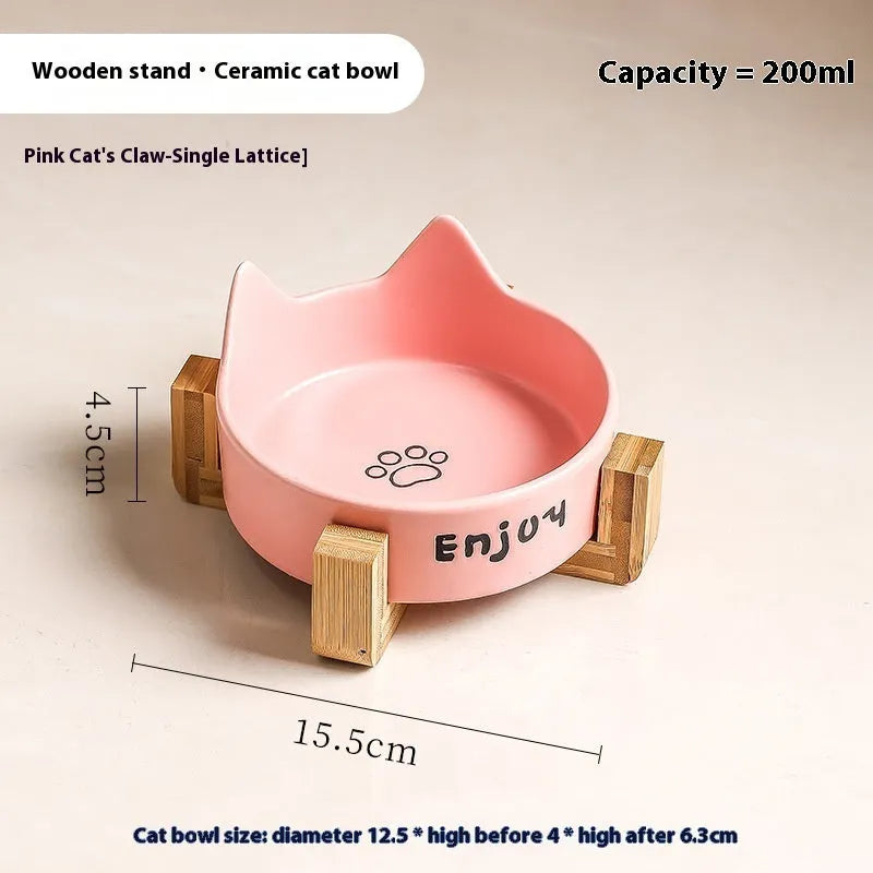 Porcelain cat bowl with cat ear and paw design on a wooden feeding frame, in pink colour.