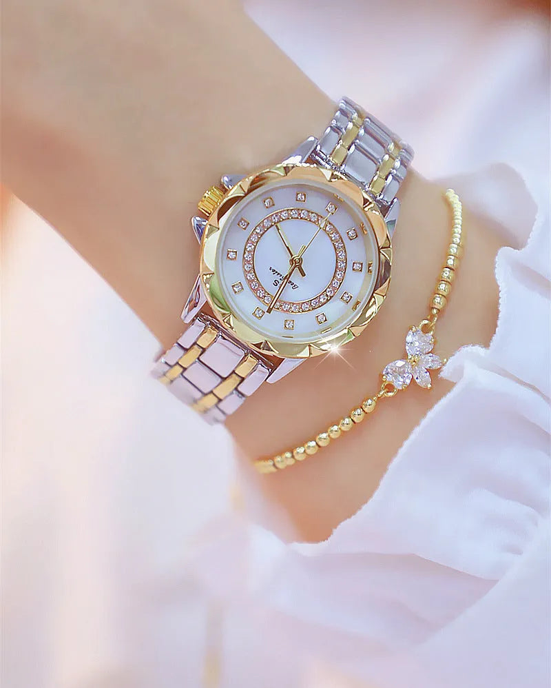 Women's quartz watch with 32mm round dial, alloy case, and mineral glass in a choice of gold or silver finishes