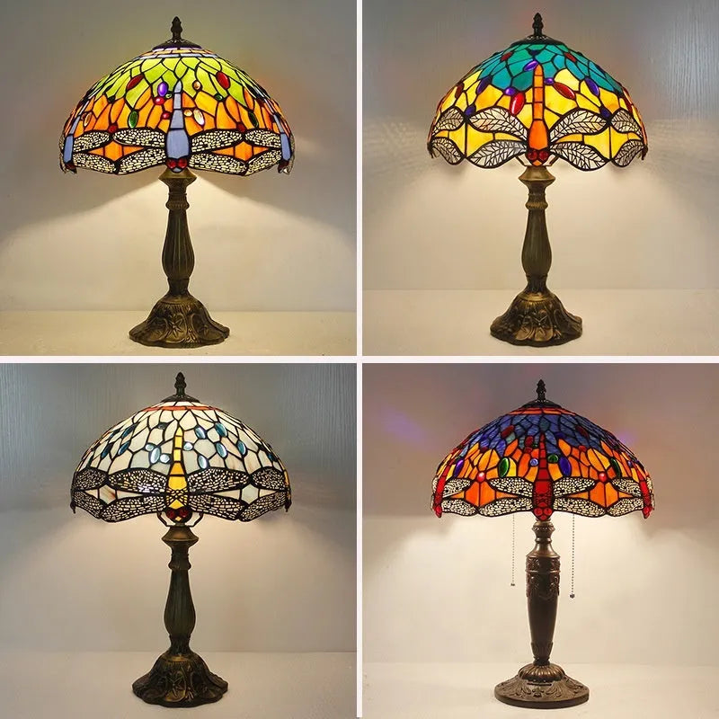 Tiffany-style stone table lamp with blue dragonfly design on a wooden surface.