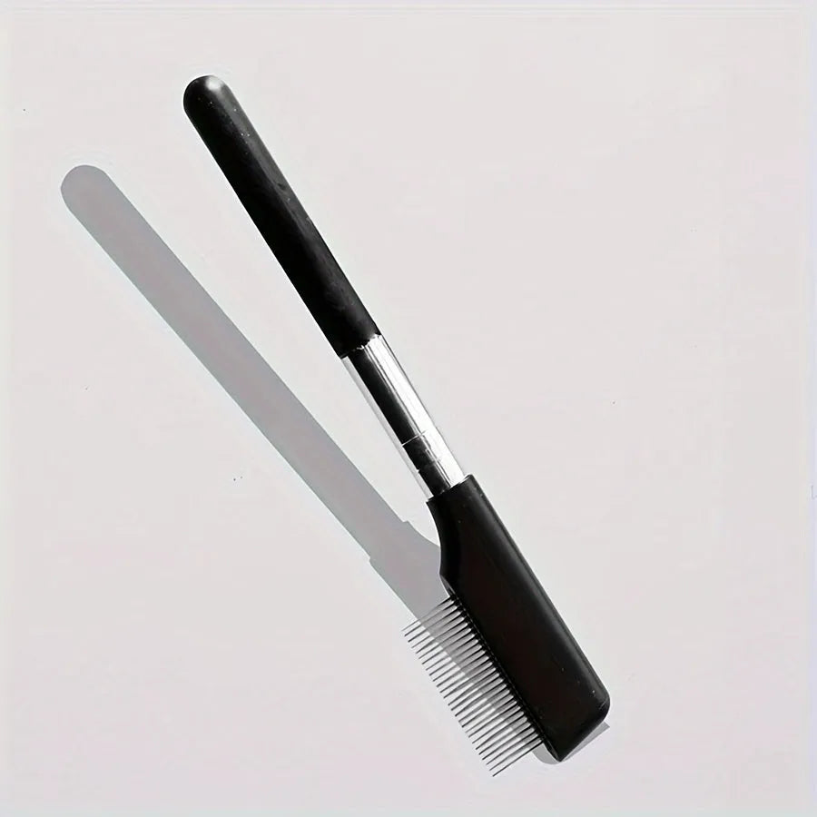 Black pet grooming brush with soft silicone bristles and comb attachment for dogs and cats
