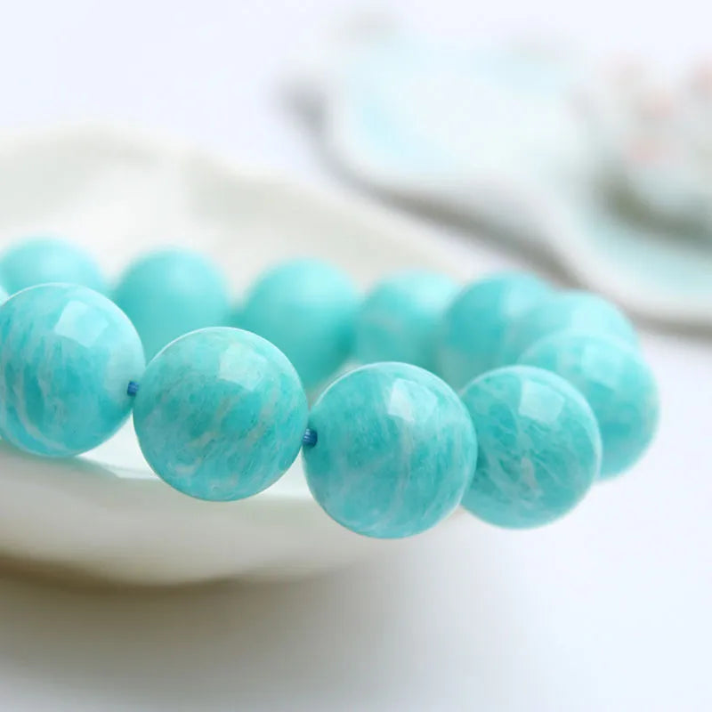 Amazonite gemstone bracelet showing natural blue-green beads in one of three available sizes: 8mm, 9mm or 10mm diameter