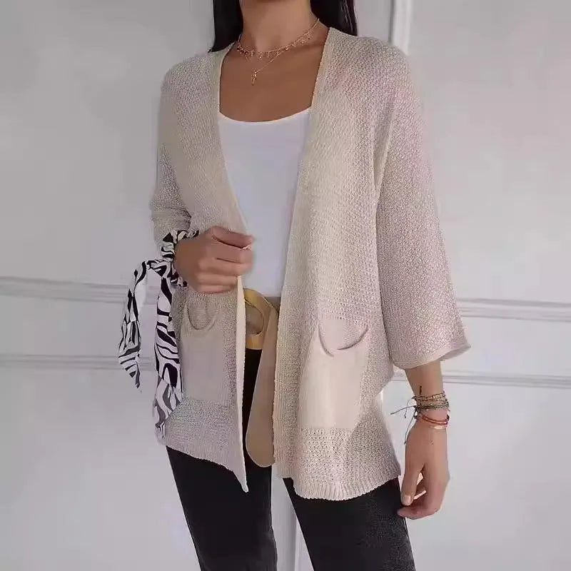 Women's waffle texture cardigan coat with nine-quarter sleeves in army green colour showing side pockets