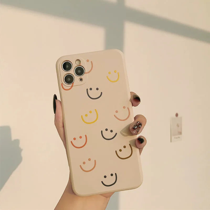 Simple silicone iPhone case with smiley face design in multiple colour options