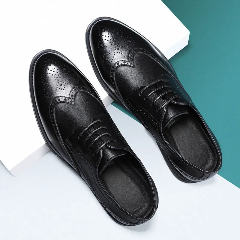 Men's classic brown brogue leather business shoes on a white background.