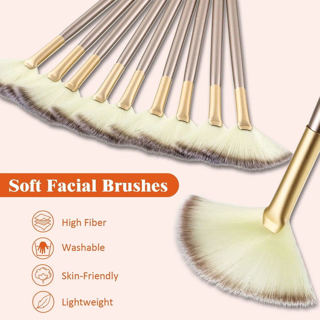 Set of 10 champagne-coloured facial fan brushes with wooden handles on a white background.