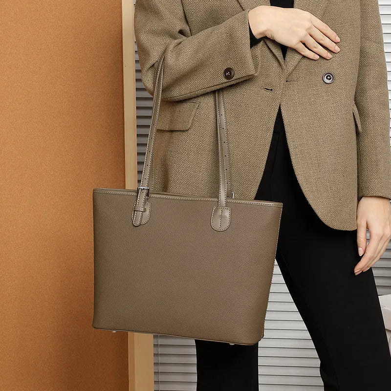 Genuine leather retro women's tote bag in horizontal square shape, showing internal zipper and phone pockets.