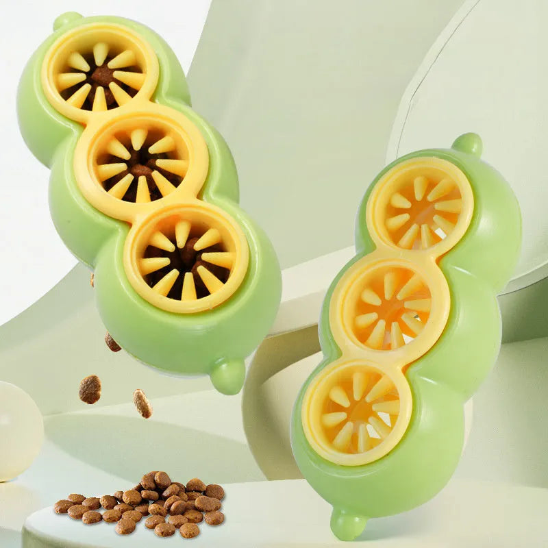 Green dog puzzle toy with food leak openings and bite-resistant material on a white background