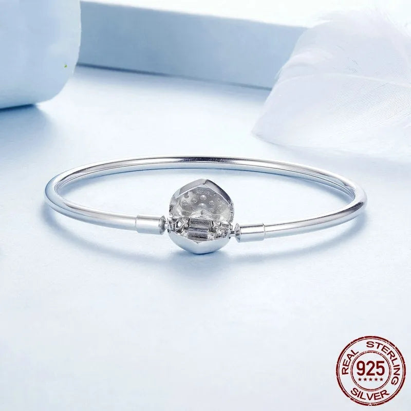 S925 sterling silver heart-shaped cubic zirconia bracelet with buckle clasp on white background