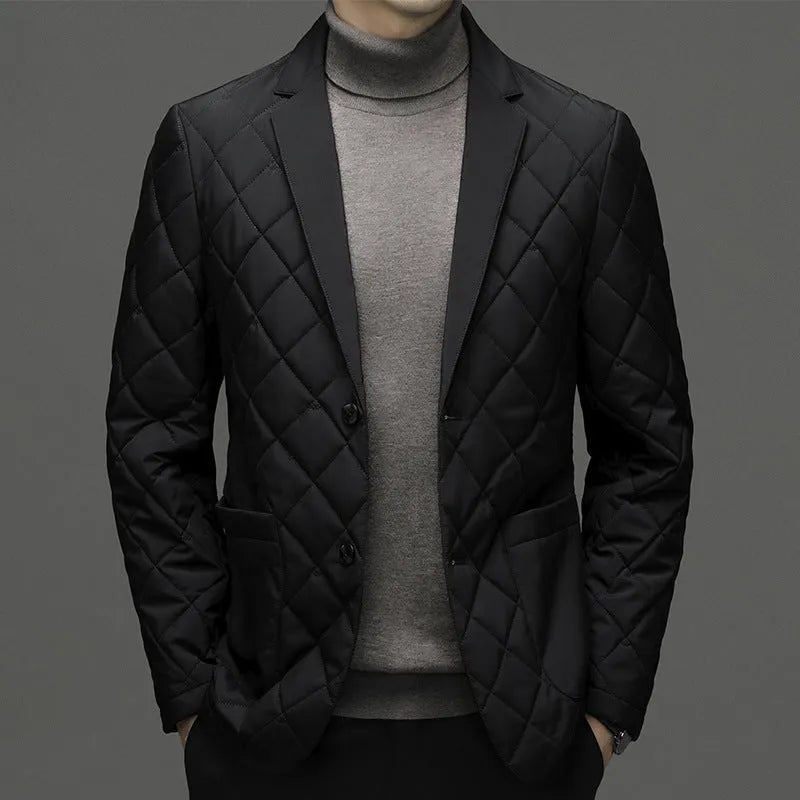 Man wearing a solid colour thick lapel down jacket with side seam pockets.